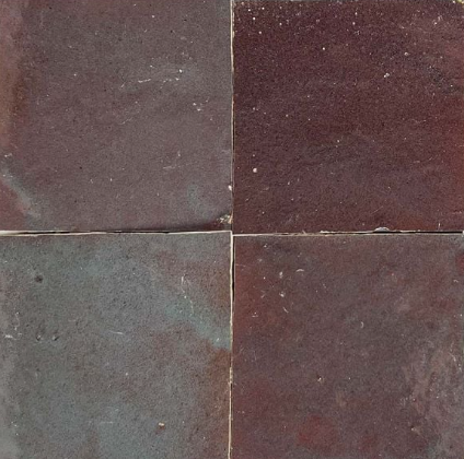 Four square Thistle, Extra Sample tiles by New York Cement Tile, dark reddish-brown with uneven surfaces and thin grout lines.