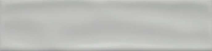 The CRAFT II Glazed Gray Ceramic Tile by New York Cement Tile features a glossy, wavy texture for modern wall designs.