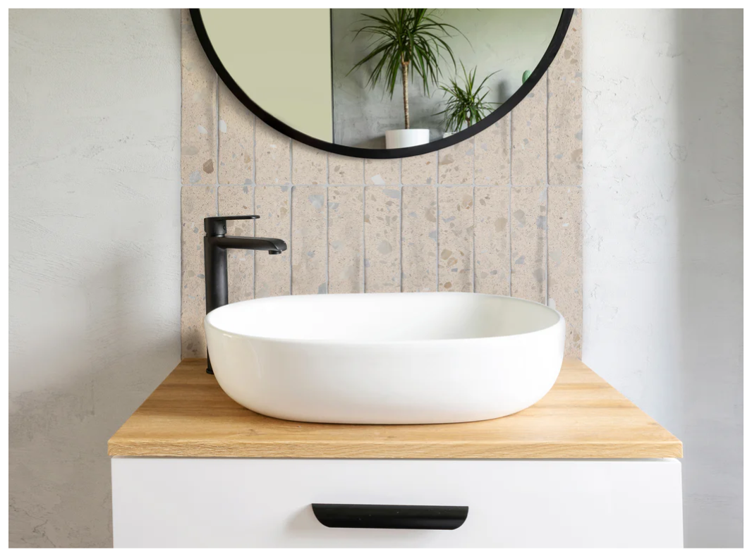 Modern bathroom sink on wood vanity, featuring the vibrant CORRAZZO-HUESO by New York Cement Tile.