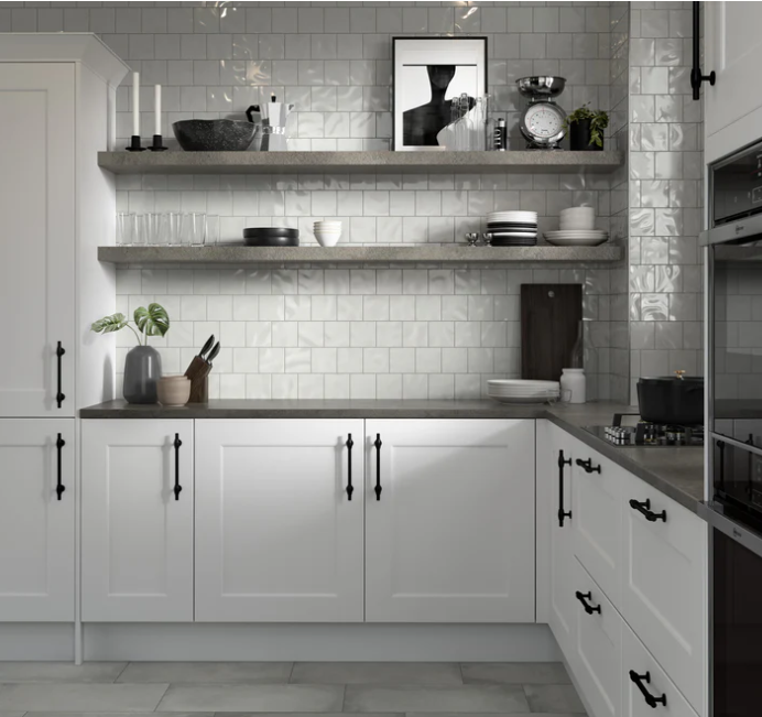 Modern kitchen with white cabinets, open shelves, gray countertop, and a CRAFT II-4X4 Glossy-White tile backsplash.