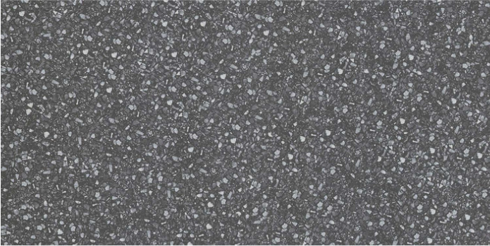 Close-up of New York Cement Tile’s FRAGMENTO- BLACK SMALL SPECKLE, Extra Sample with scattered light and dark flecks.