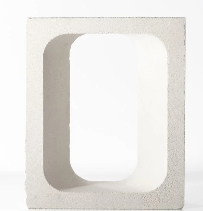 The GLAPA by New York Cement Tile is a white concrete block featuring a large rectangular hole, shown on a plain white background.