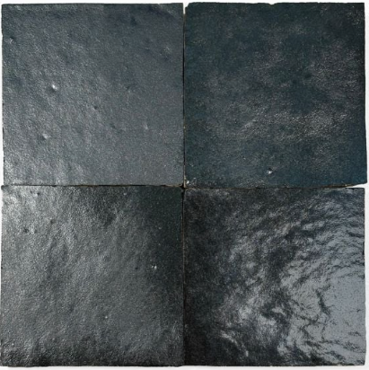 Four Metallic Black Onyx tiles by New York Cement Tile in a 2x2 grid, each with unique handcrafted surface texture.