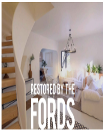 A modern living room with white furniture, wooden stairs, and text: Restored by the Fords.