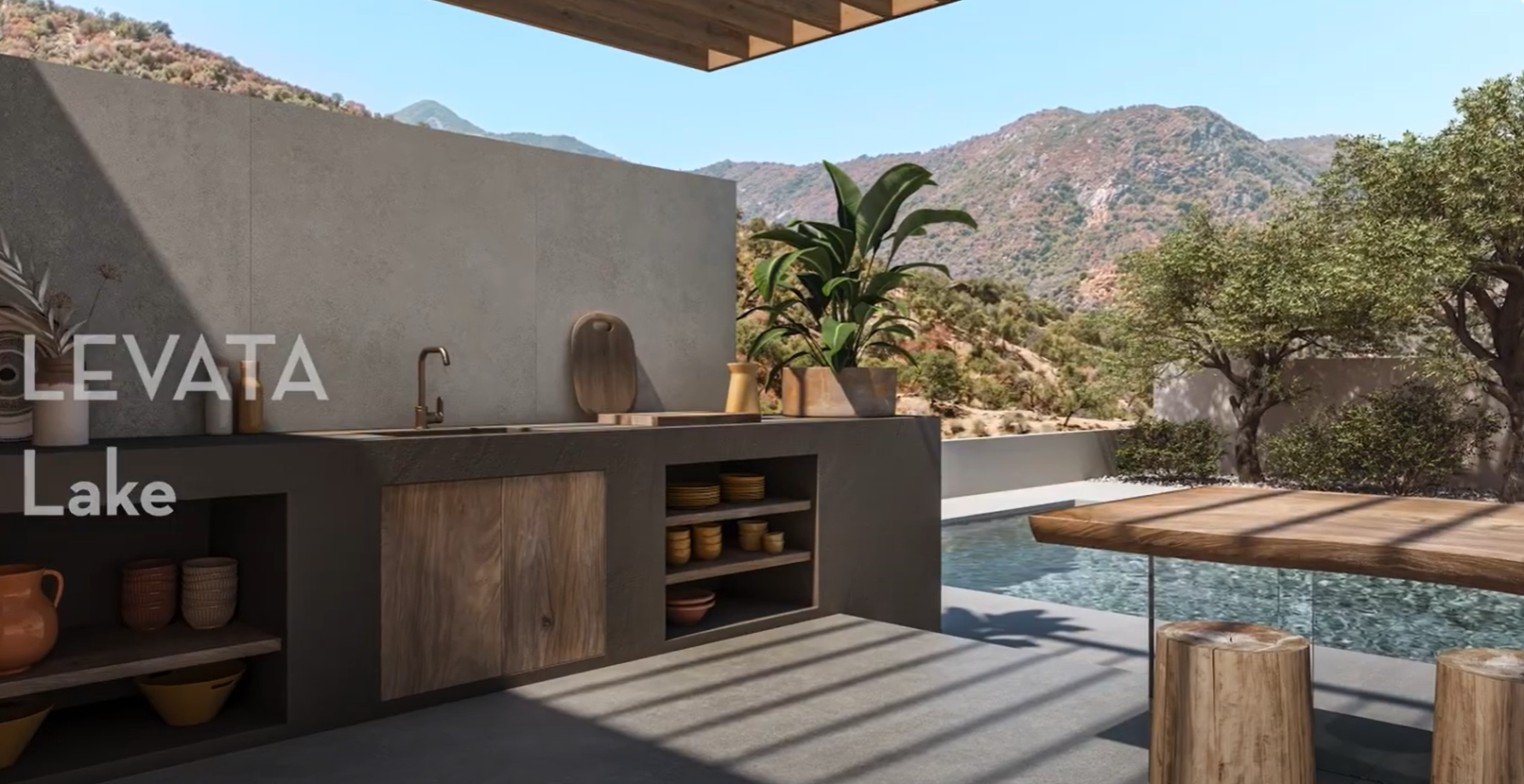 Modern outdoor kitchen with wood accents, open shelves, potted plants, and mountain views near a pool under clear skies.