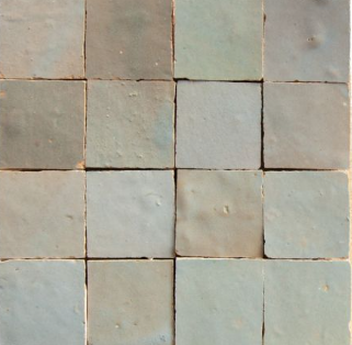 Sixteen Arctic Blue 2x2 tiles by New York Cement Tile in a 4x4 grid, each showing subtle texture and color variations.