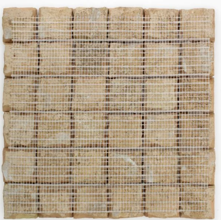 A square Sunflower Yellow 2x2 tile by New York Cement Tile, arranged in a grid and backed with white mesh.