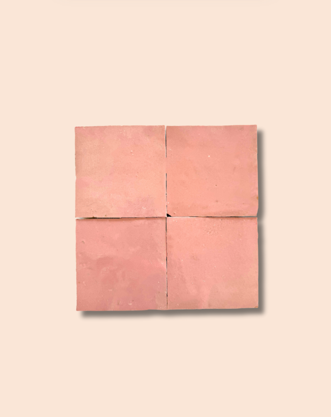 Four Warm Peach tiles by New York Cement Tile in a 2x2 grid on beige, with subtle shadows.