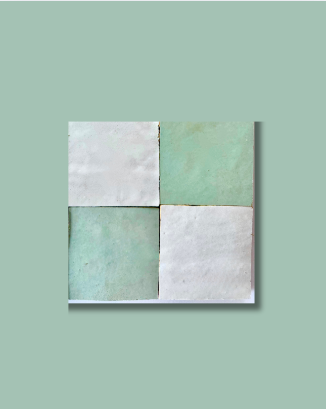 Four handcrafted Mint Frost tiles by New York Cement Tile, in mint green and off-white on a light green background.