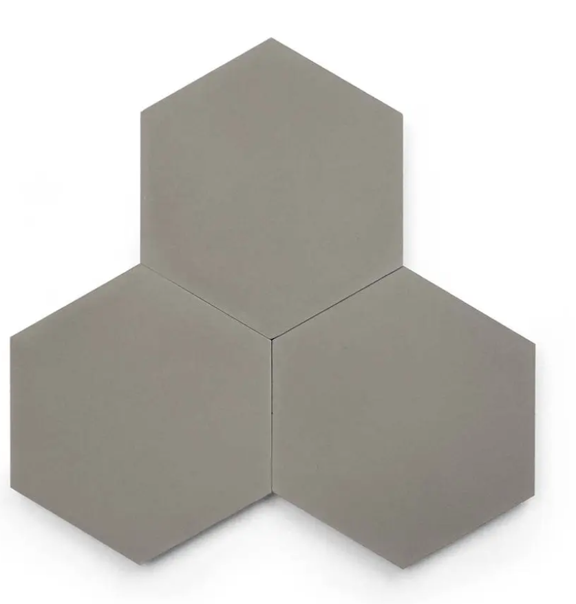 Three Solid Hex-GREY tiles by New York Cement Tile clustered together on a white background.