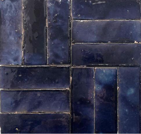 Close-up of Metallic Blue (2X6) tile by New York Cement Tile, arranged in a glossy geometric pattern.