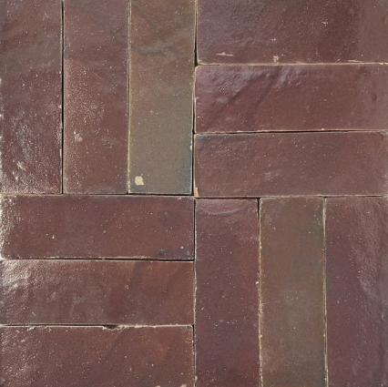 Pattern of brown rectangular tiles arranged in a grid