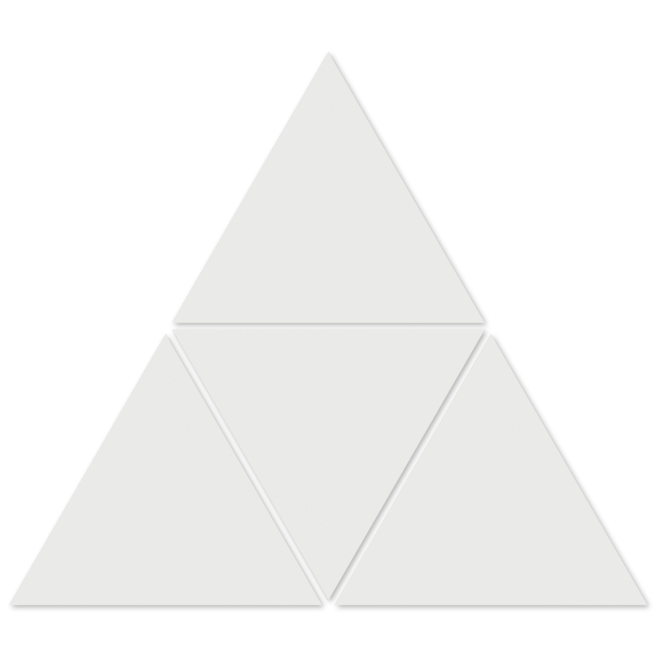 Four 1100-Solid White Triangle tiles from New York Cement Tile form a larger triangle with gaps—great for geometric designs.