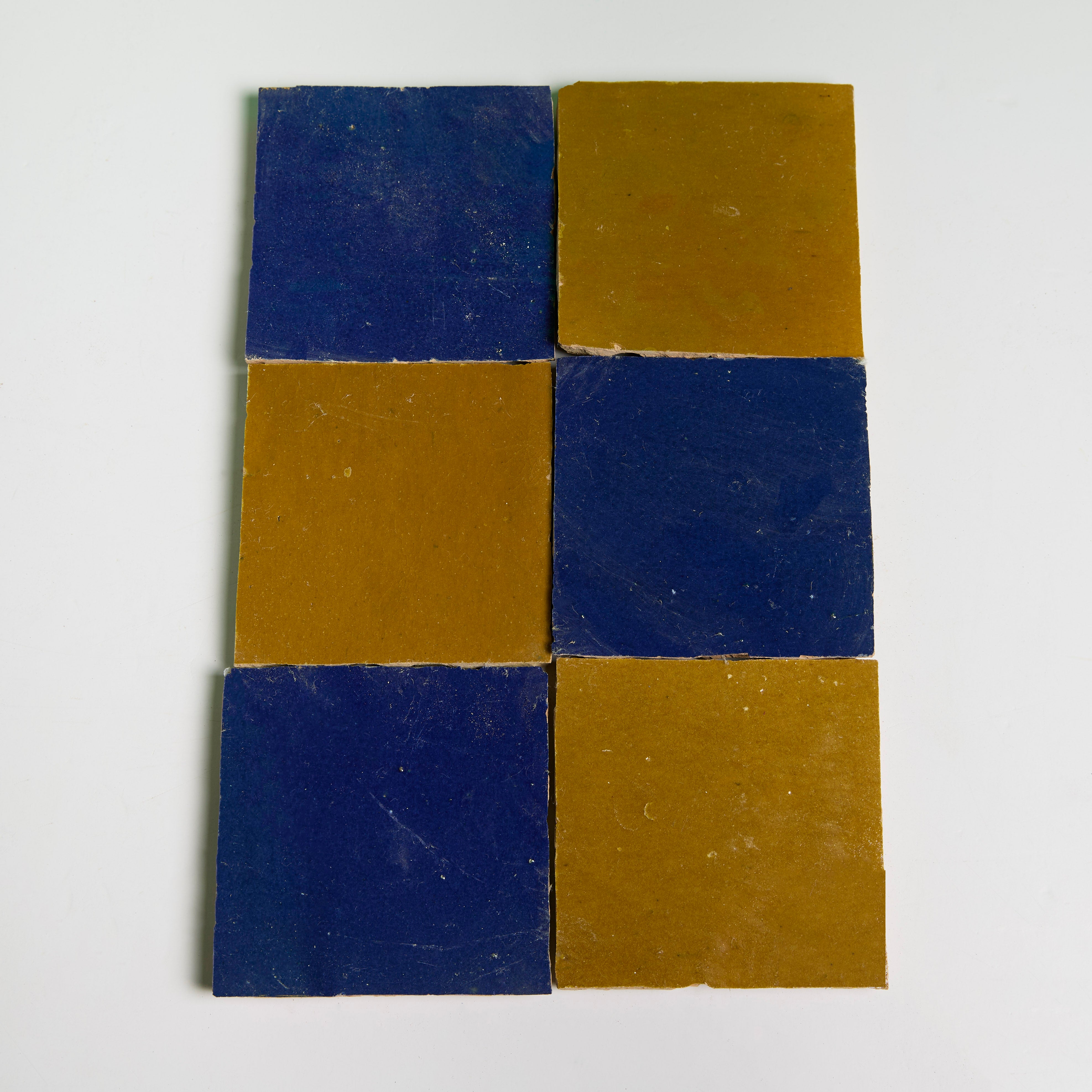 Six Caramel Glazed tiles by New York Cement Tile, handcrafted from natural clay, displayed on a white background.
