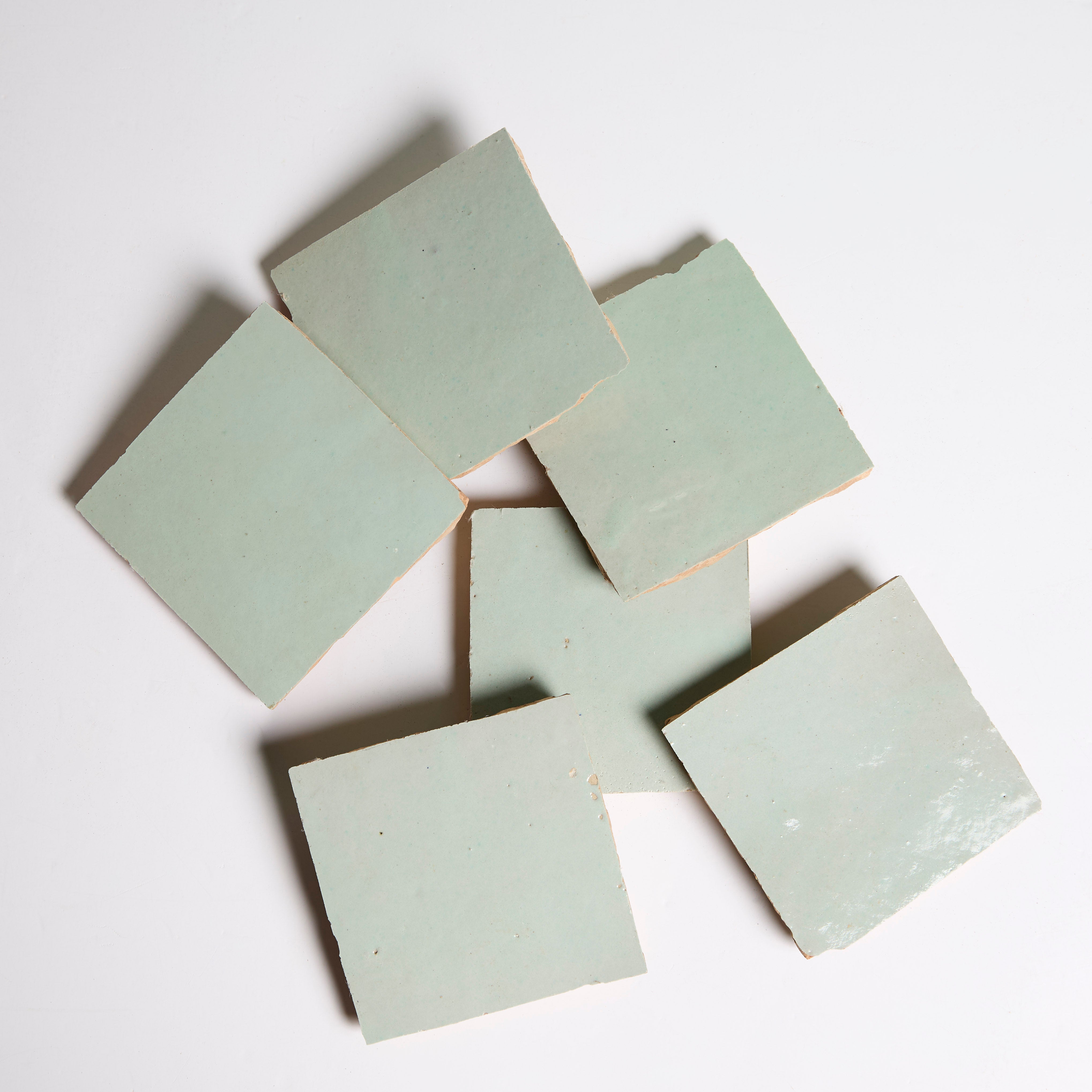 Five Mint Frost tiles by New York Cement Tile are arranged loosely on a white background.