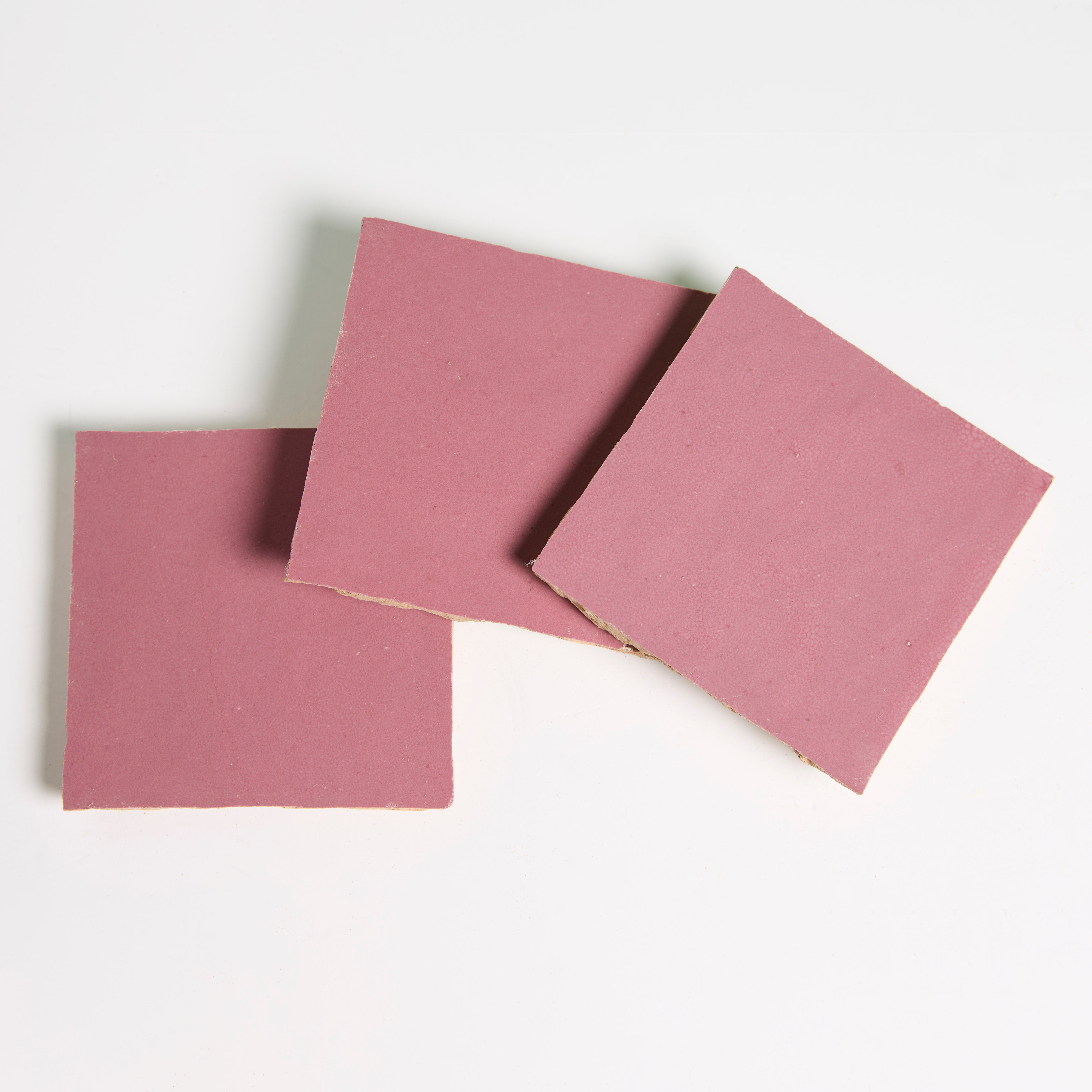 Three Vintage Rose chocolates from New York Cement Tile are arranged like handcrafted tiles on a white background.
