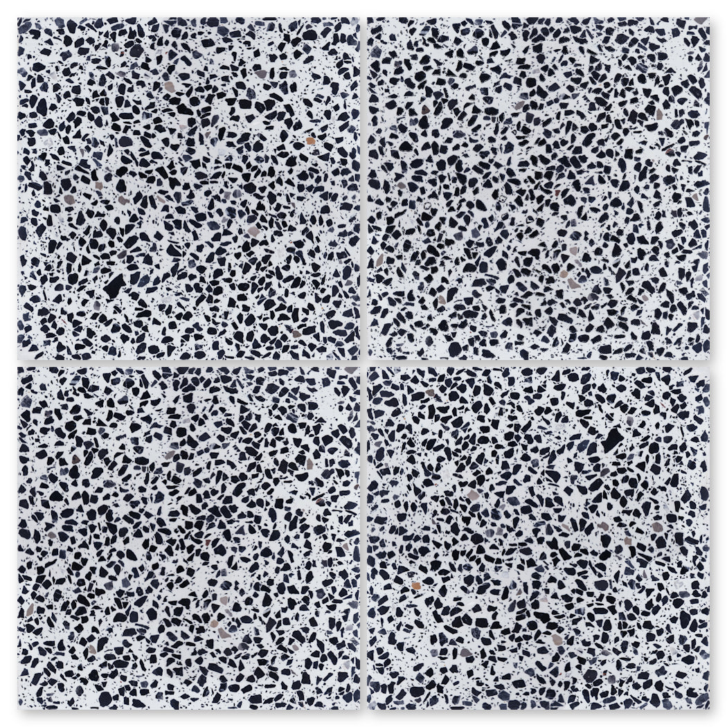 The Terrazzo 12X12-NT30-Leopard Sample by New York Cement Tile offers durable, grey & black mosaic-look flooring.