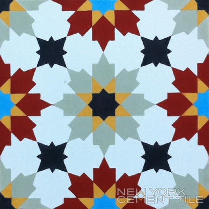 The N20-028 Extra Sample from New York Cement Tile features a symmetric, star-like tile in red, white, blue, black & beige.