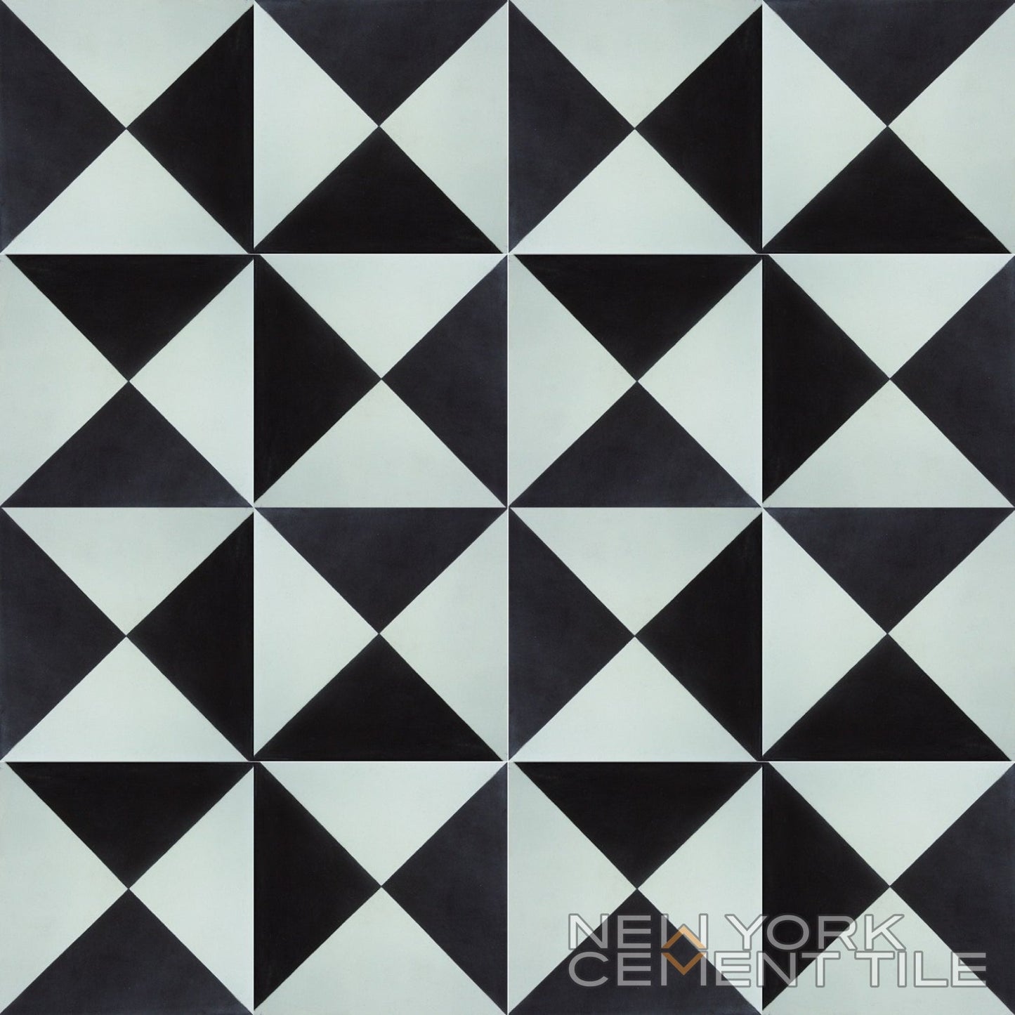 Geometric black and white N20-032 cement tile sample by New York Cement Tile; triangles form diamond shapes.