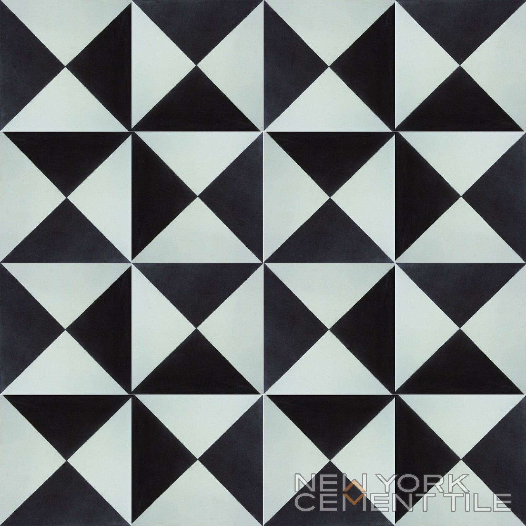 Geometric black and white N20-032 cement tile sample by New York Cement Tile; triangles form diamond shapes.