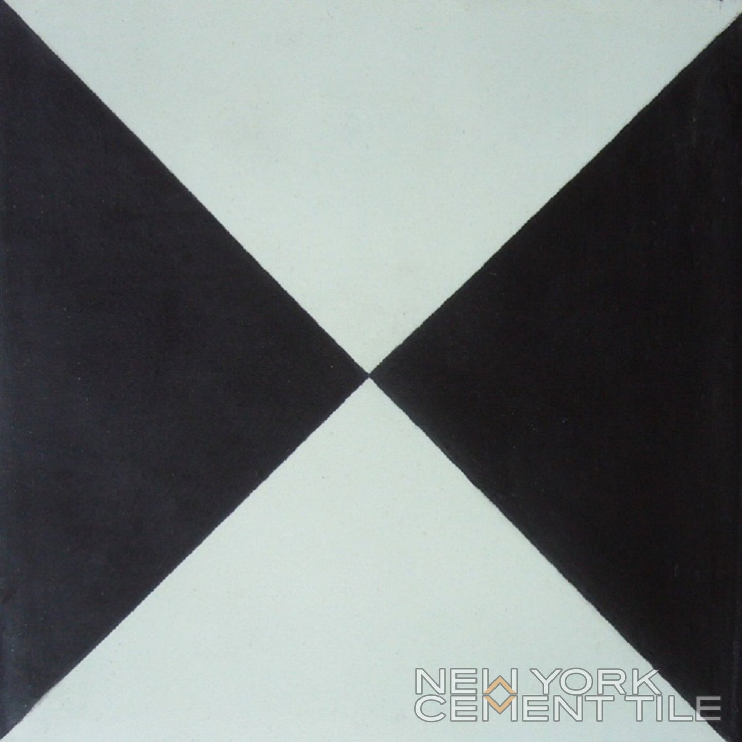 N20-032, Sample: Black and white cement tile with two black triangles; New York Cement Tile branding in the corner.