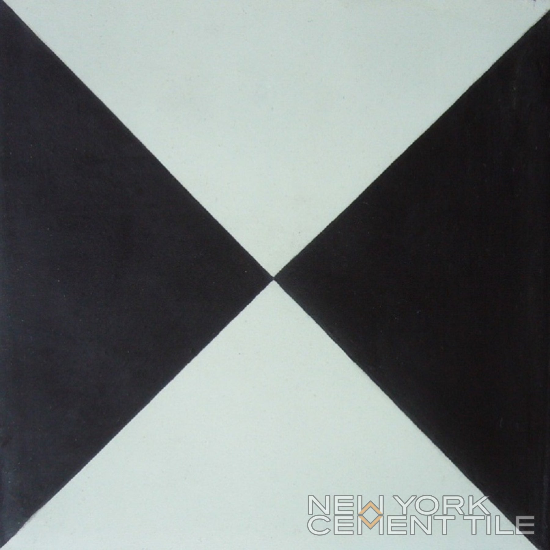 N20-032, Sample: Black and white cement tile with two black triangles; New York Cement Tile branding in the corner.