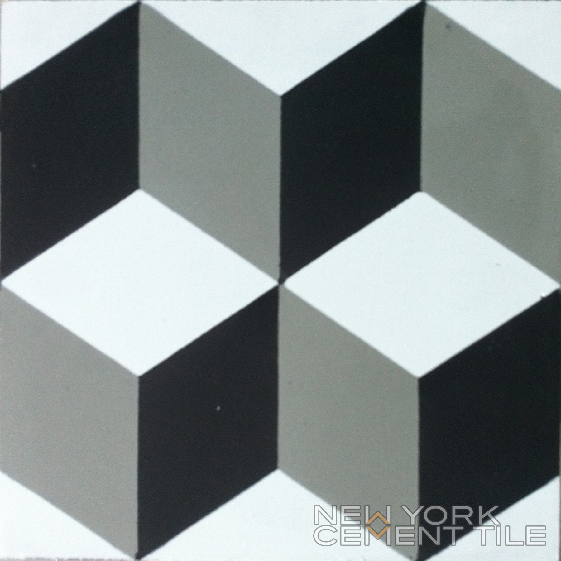 Geometric tile pattern (N20-171) with black, gray & white cubes by New York Cement Tile. Durable optical illusion flooring.