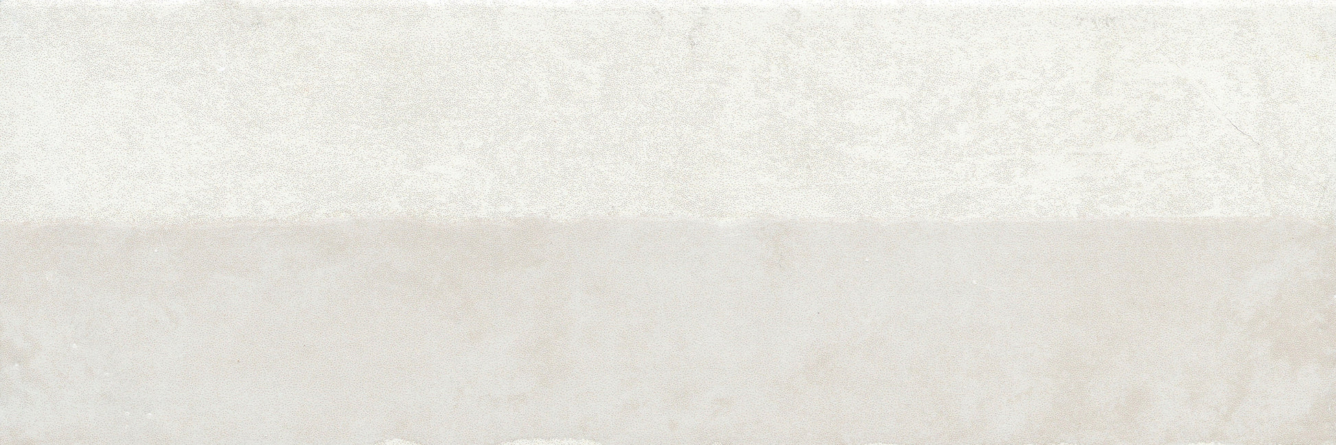 White Demi, Extra Sample by New York Cement Tile: Off-white top and light beige bottom with a textured, modern tile look.