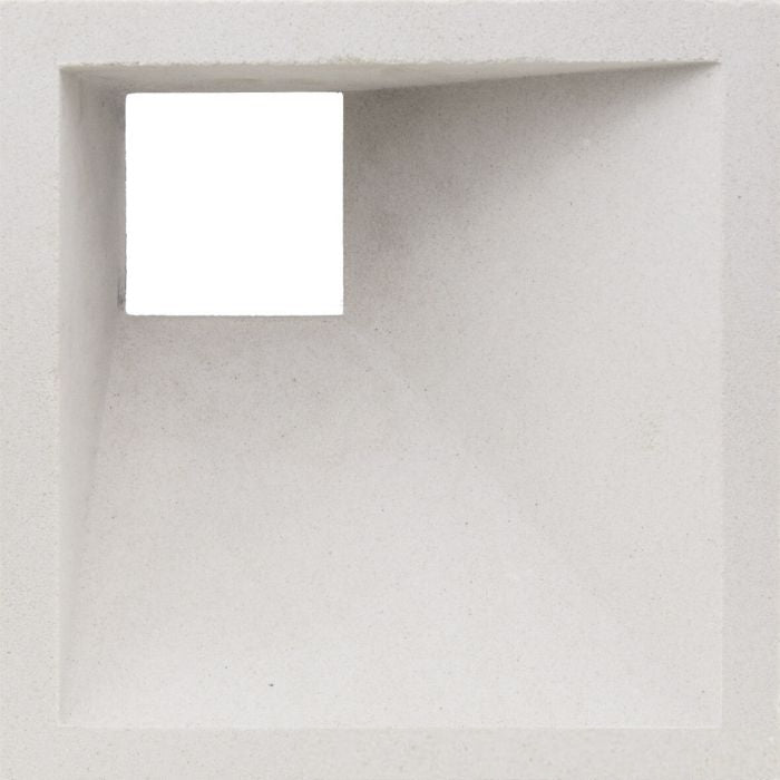 Akutan Extra Sample by New York Cement Tile features a textured white square hole for striking geometric shadow effects.
