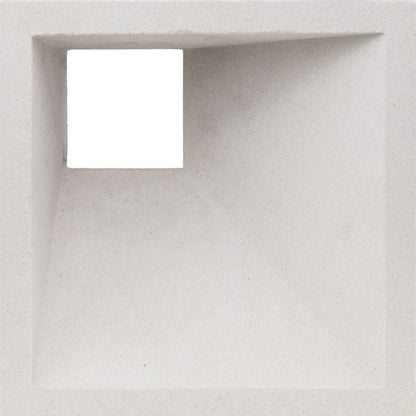 Akutan Extra Sample by New York Cement Tile features a textured white square hole for striking geometric shadow effects.