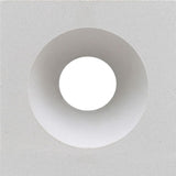 The Gada by New York Cement Tile is a white square mid-century concrete screen with a central circular tunnel-like opening.
