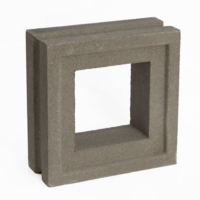 The Large Arbie Sample by New York Cement Tile is a square, gray breeze block with a hollow center on a white background.