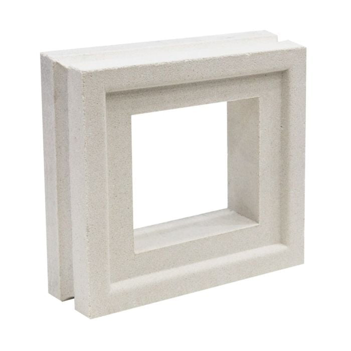 The Large Arbie Sample by New York Cement Tile is a white, square breeze block with thick, beveled edges on display.