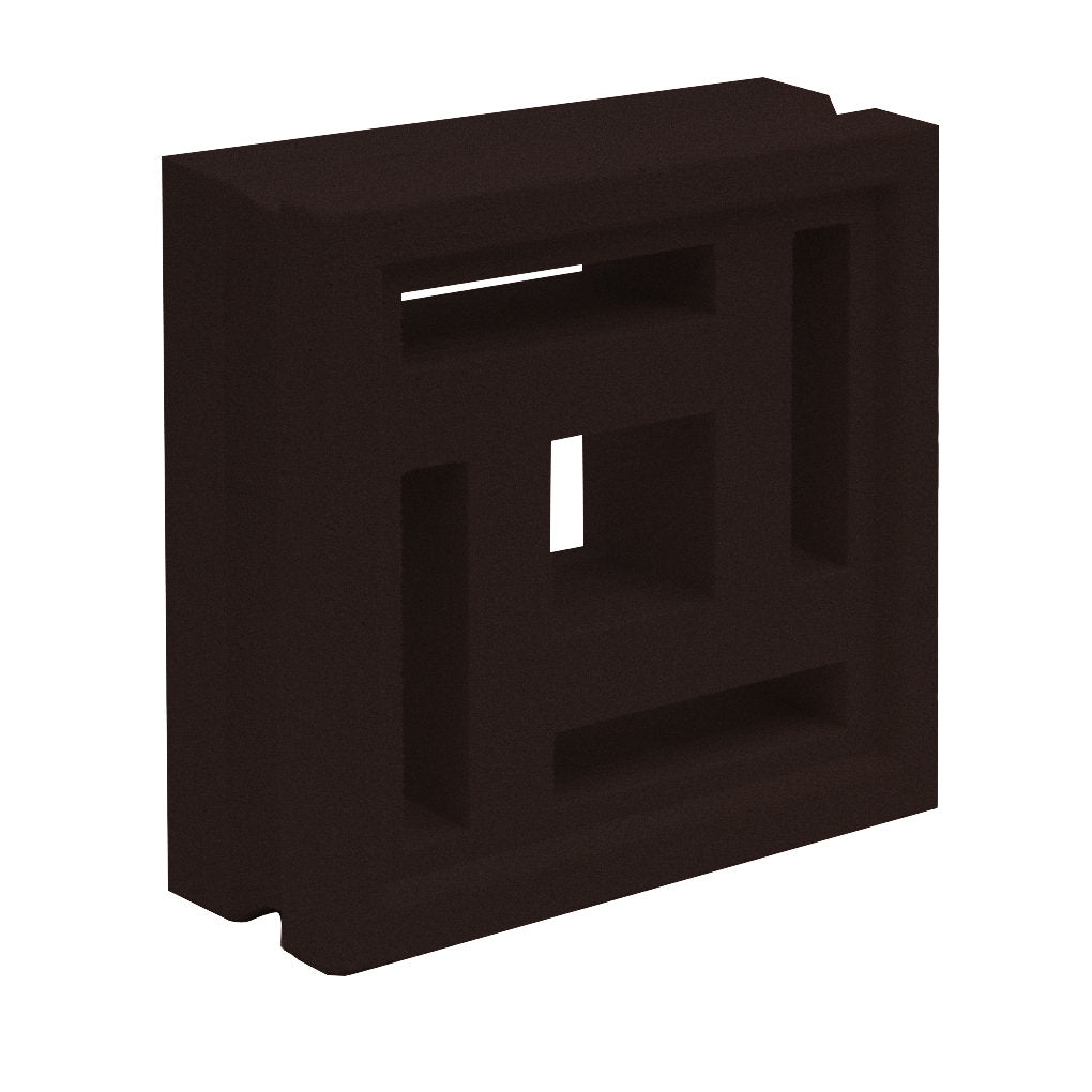 The Carabado Sample by New York Cement Tile is a dark breeze block with geometric cutouts in a striking symmetrical design.