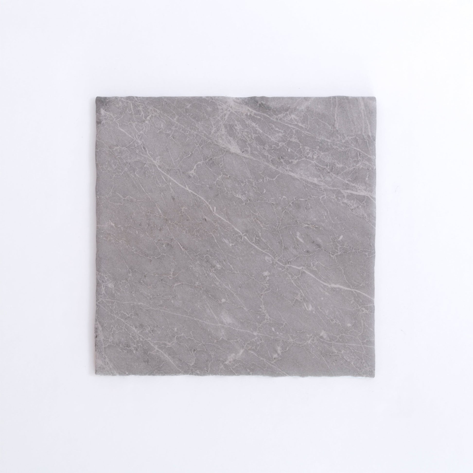 Nine Bardiglio tiles by New York Cement Tile arranged in a 3x3 grid on a plain white background.