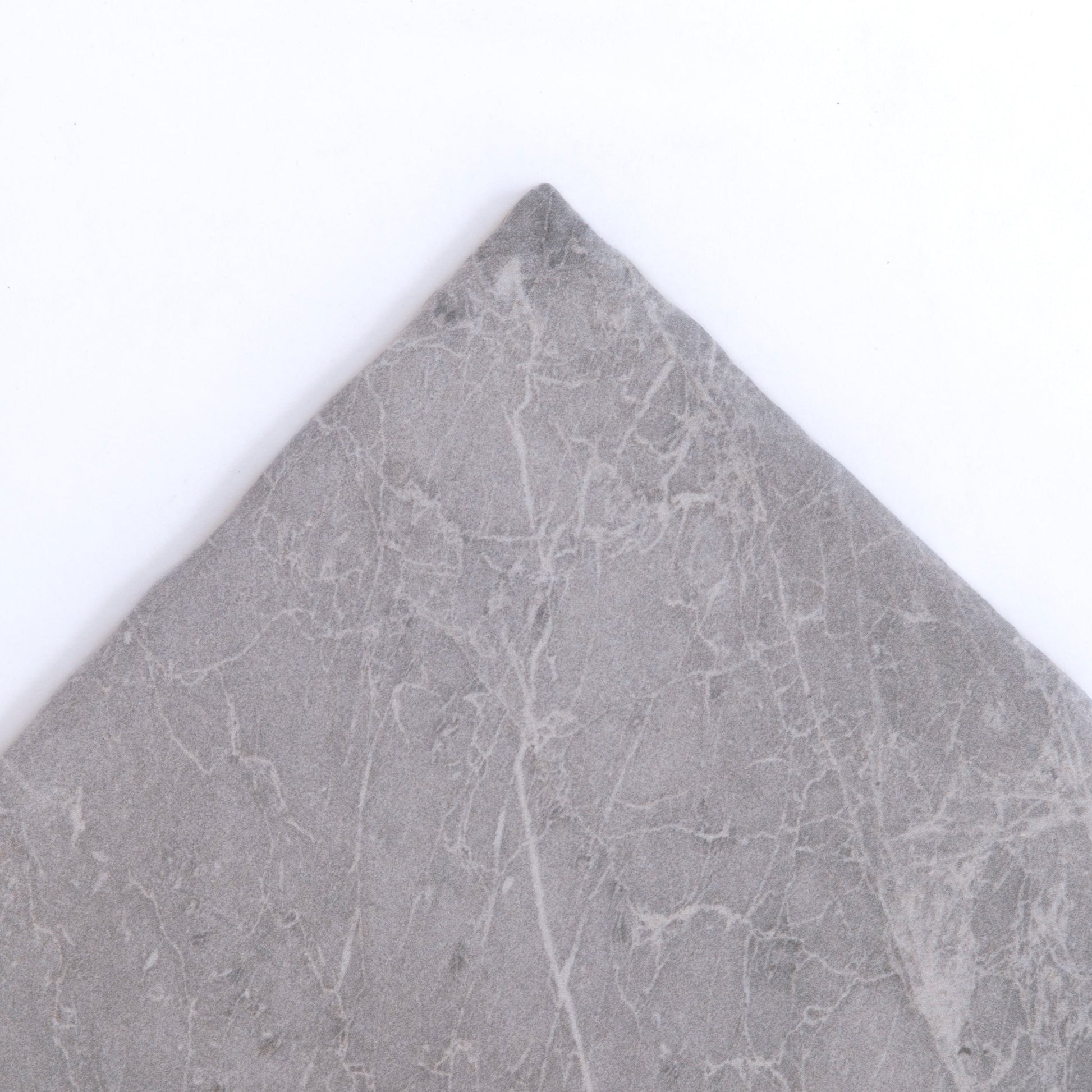 The Bardiglio by New York Cement Tile is a square gray marble tile with subtle white veining on a plain white background.