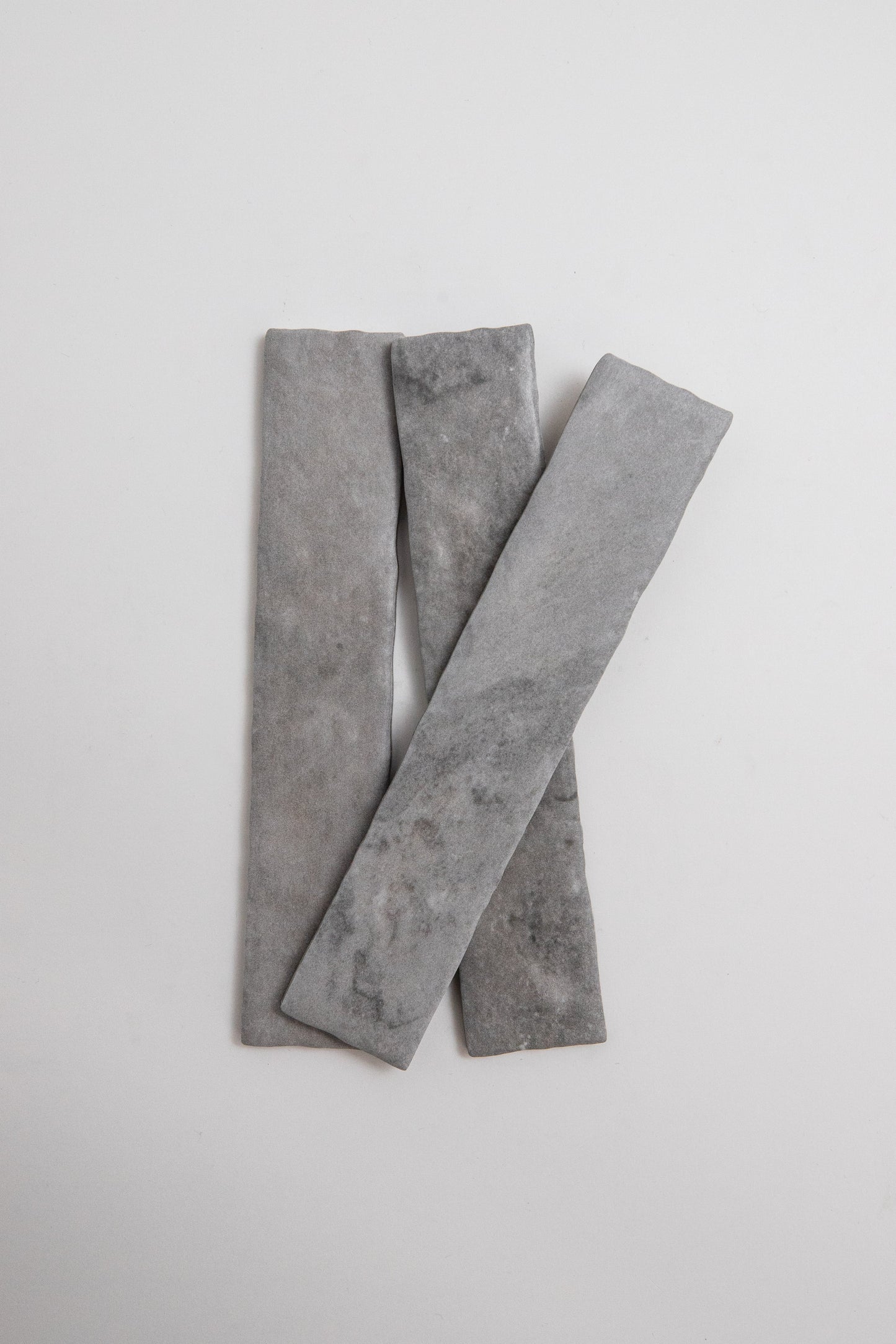 Three Bardiglio sample tiles by Tosca overlap on a plain white background.