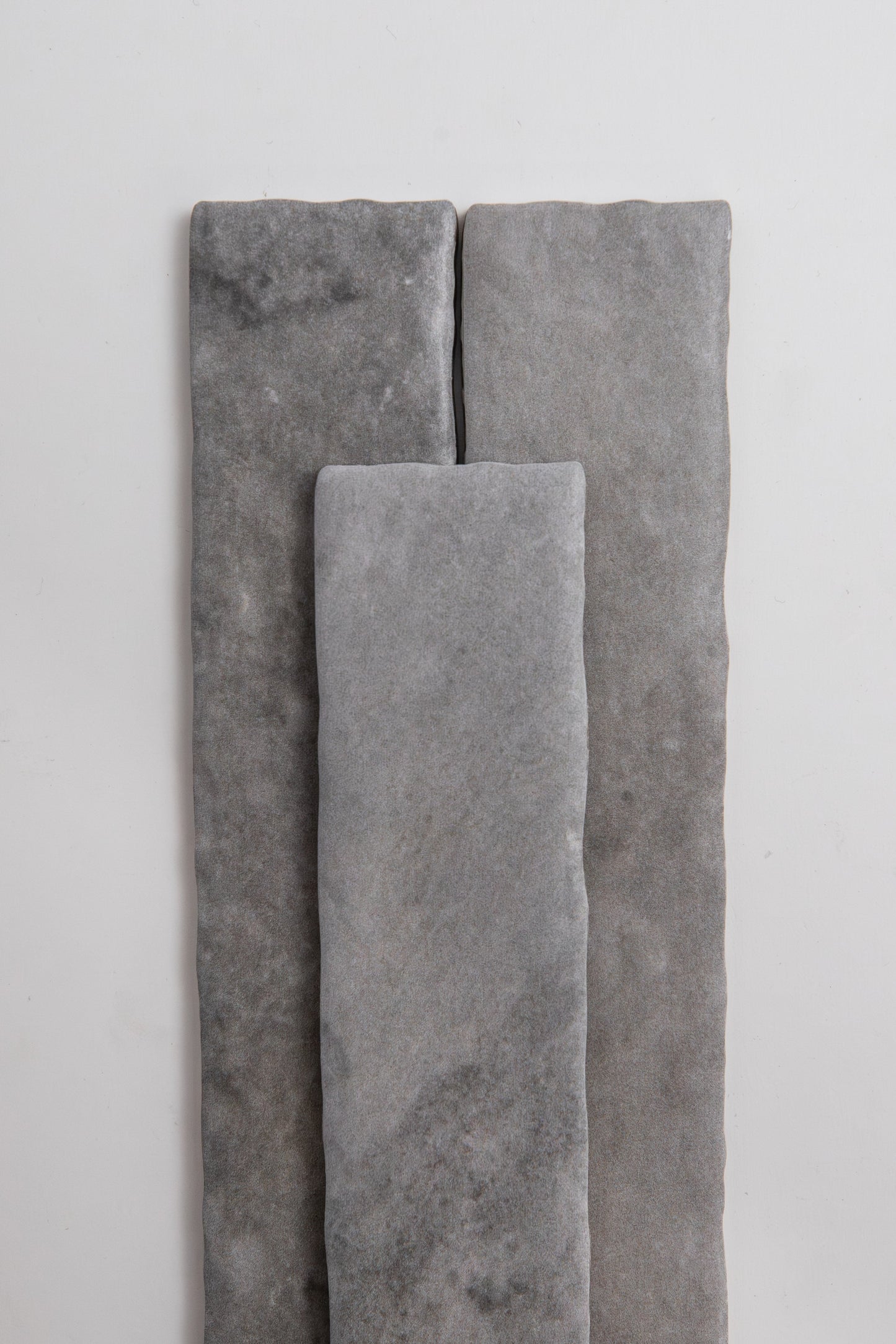 Three Bardiglio rectangle tiles by Tosca are arranged vertically on a plain white background.