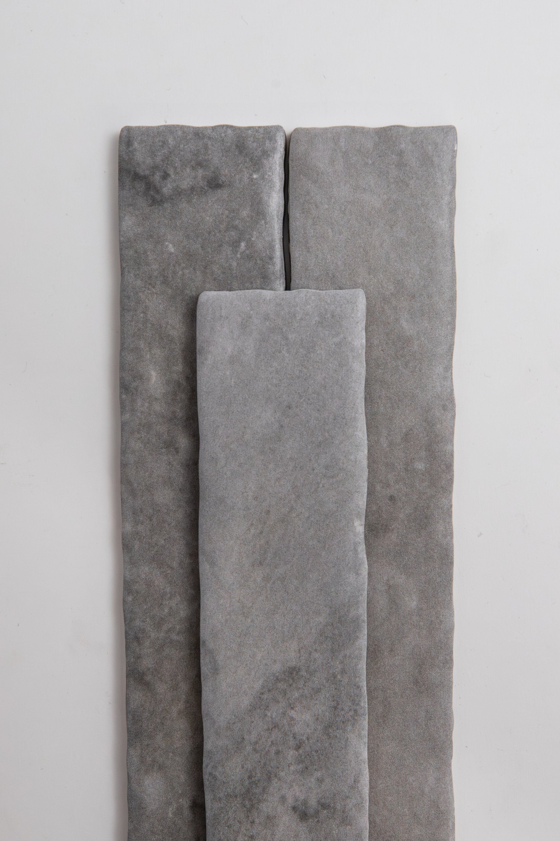 Three Bardiglio rectangle tiles by Tosca are arranged vertically on a plain white background.