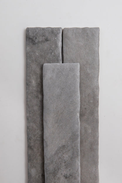 Three Bardiglio rectangle tiles by Tosca are arranged vertically on a plain white background.