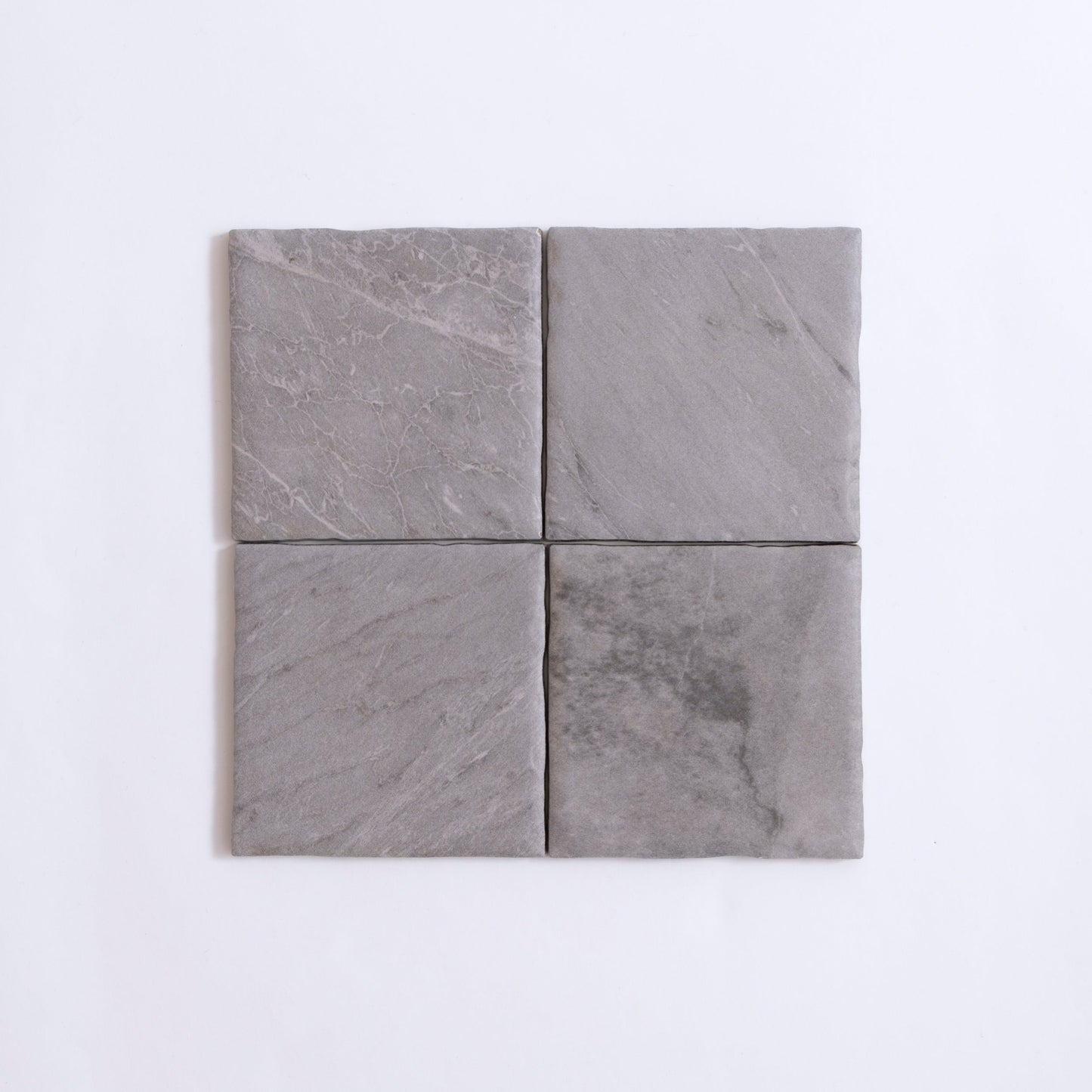 Four square Bardiglio tiles by Tosca arranged in a 2x2 grid on a white background.