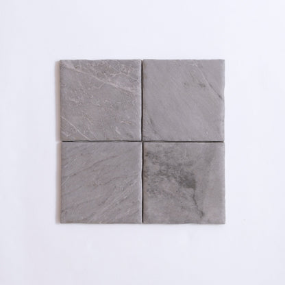 Four square Bardiglio tiles by Tosca arranged in a 2x2 grid on a white background.