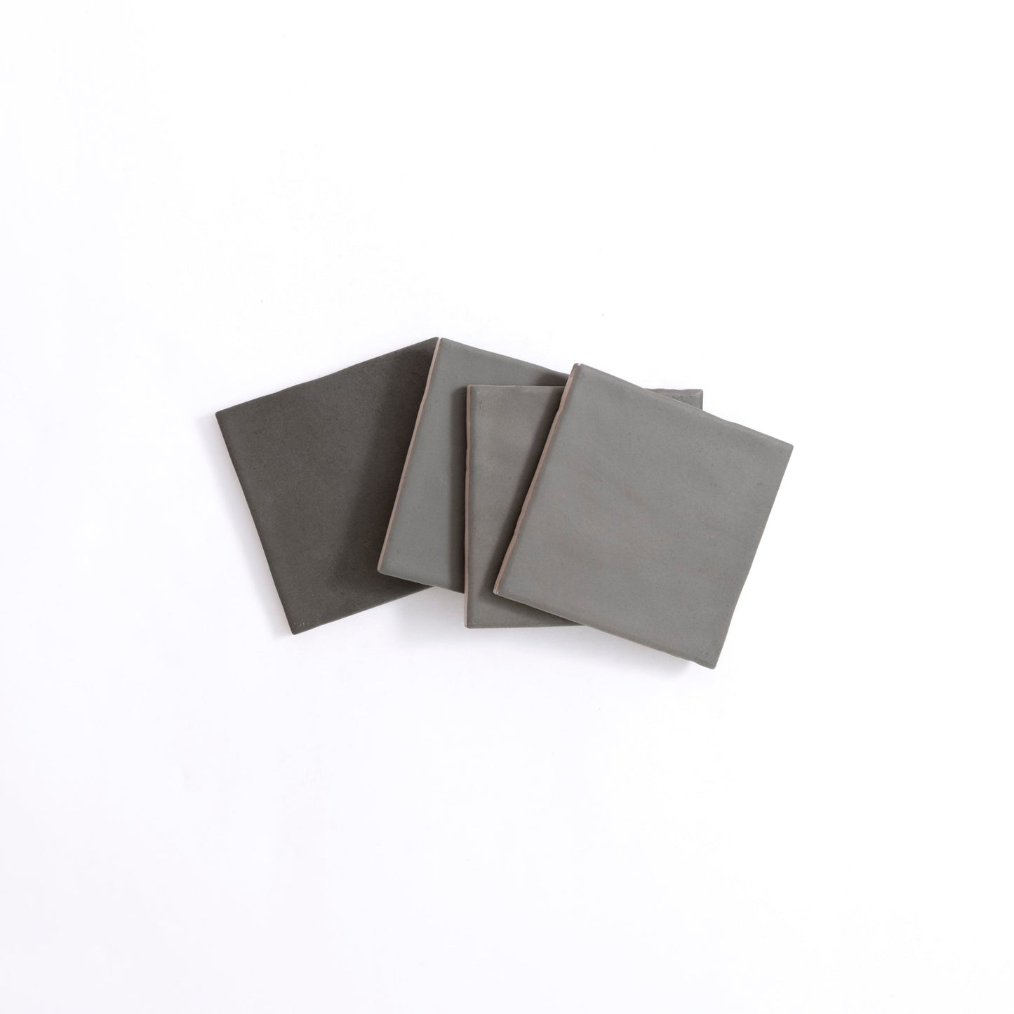 Four Bibury Dark Green tiles by Cottage Ivy arranged in a slightly overlapping pattern on a white background.