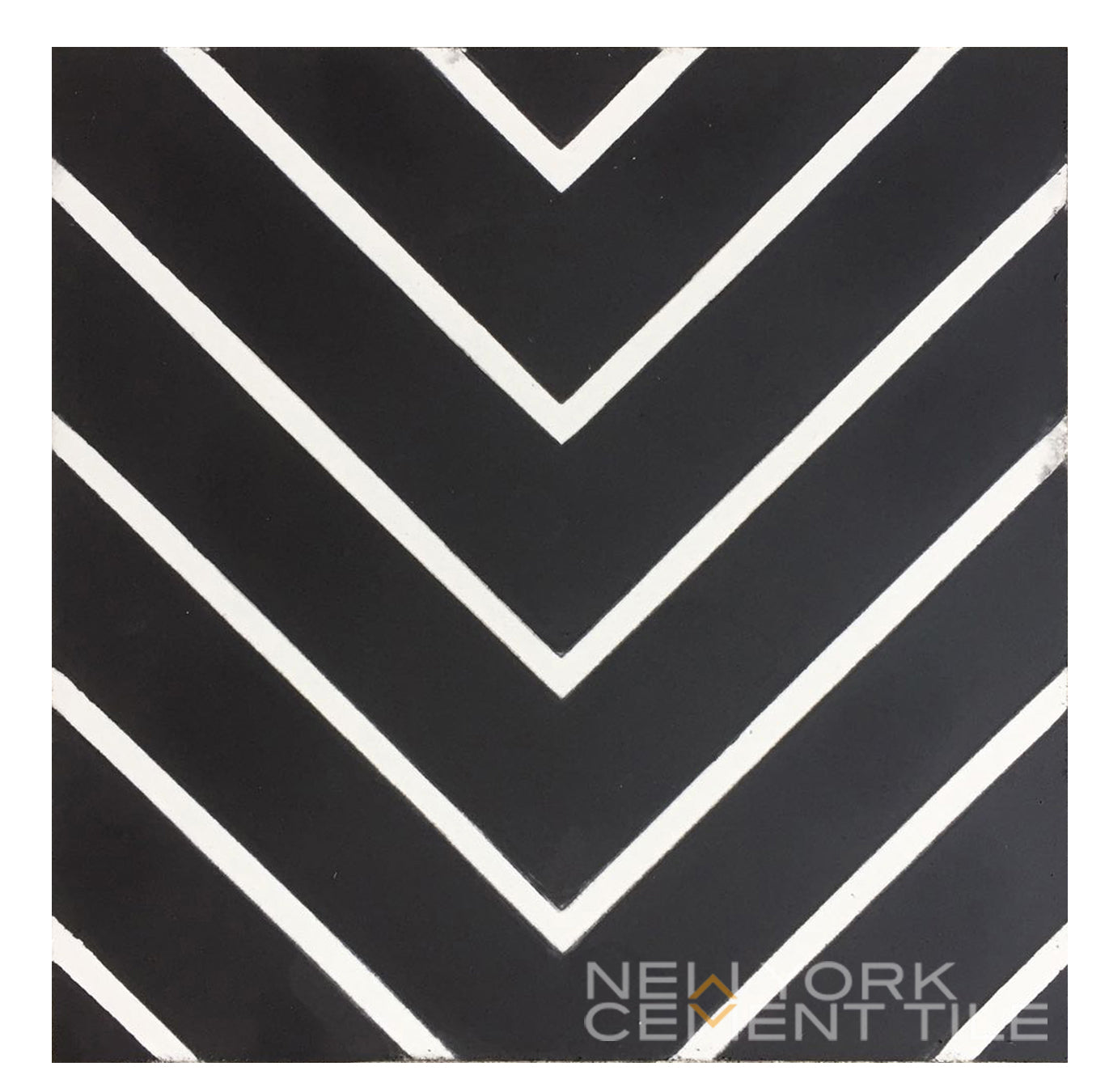 Black square tile with white chevron stripes and "N20-437, Extra Sample" from New York Cement Tile.
