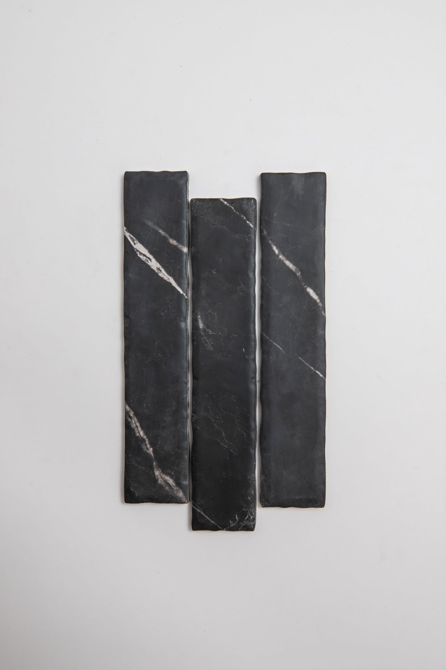 Three Tosca Black Marble, Extra Sample tiles with white veining are arranged vertically on a plain white background.