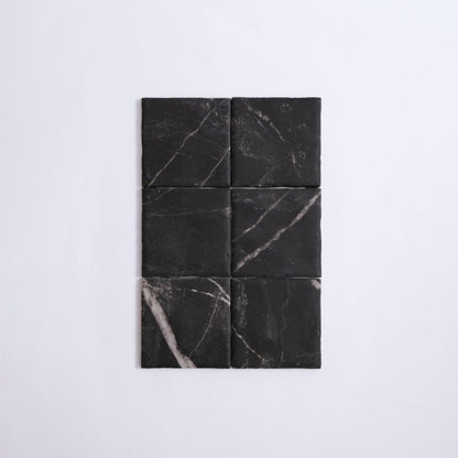 Six Tosca Black Marble Extra Sample tiles with white veining, arranged in two columns and three rows on a white background.