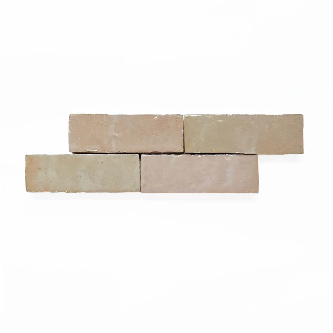 Four Blushed Glazed (2x6) tiles by New York Cement Tile, staggered horizontally on a white background.