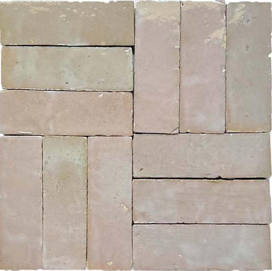 Blushed Glazed (2X6) tiles by New York Cement Tile create a geometric, alternating square mosaic in light brown.