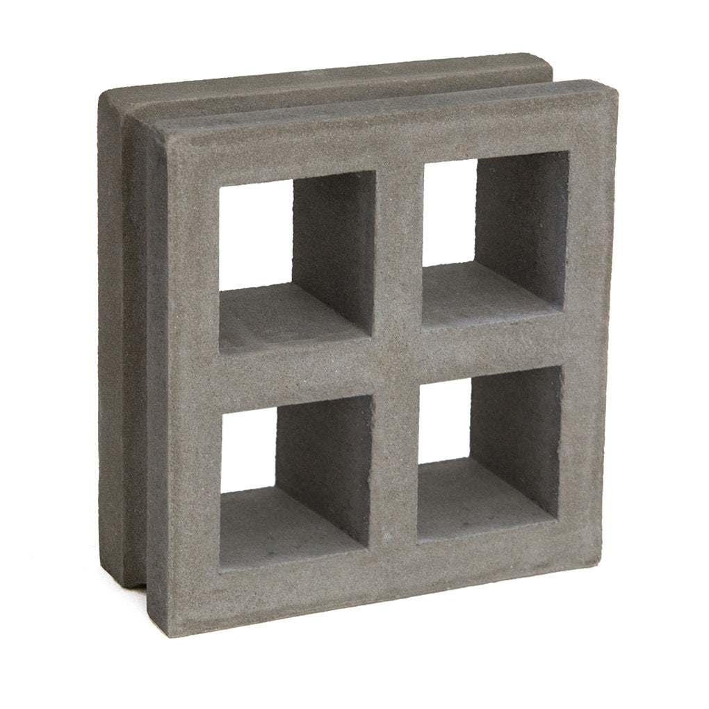 Borneo, Extra Sample by New York Cement Tile: a square block with four square openings, ideal for modern privacy screens.