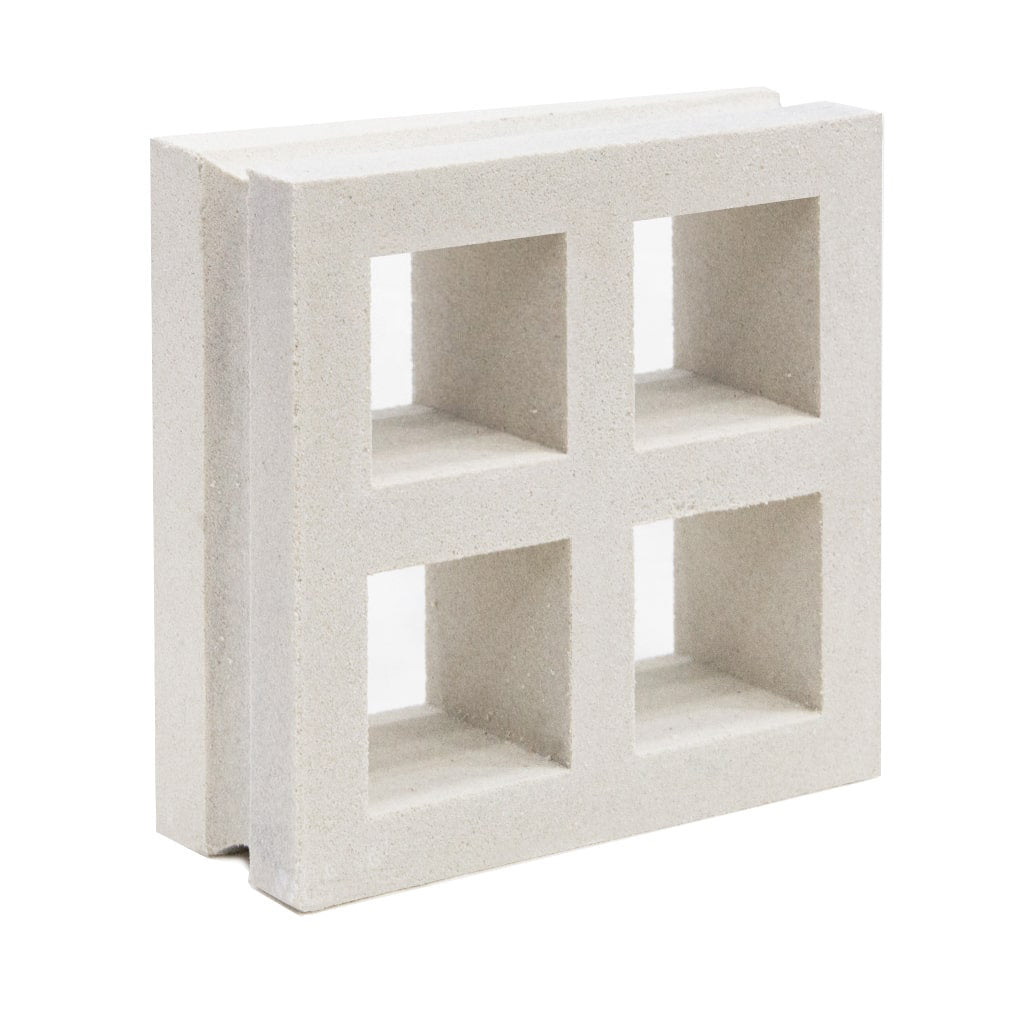 The Borneo Extra Sample by New York Cement Tile is a white block with four square openings, shown upright on a white background.